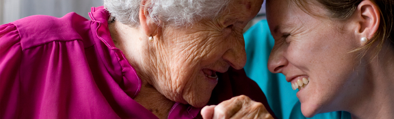 Compassionate care worker with an elderly individual